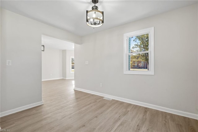 10 Church St, Windsor, VA 23487 - unfurnished room featuring a chandelier and wood finished floors