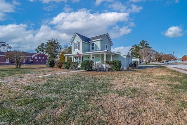 10 Church St, Windsor, VA 23487 - view of side of home with covered porch and a lawn