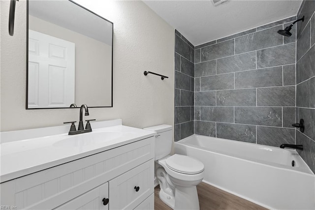 10 Church St, Windsor, VA 23487 - full bath with wood finished floors, vanity, washtub / shower combination, a textured ceiling, and a textured wall
