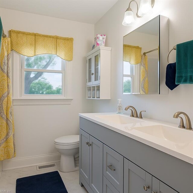 4225 Terry Dr, Chesapeake, VA 23321 - bathroom with double vanity and a shower with curtain