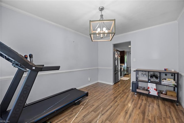 4041 Hargrove Lndg, Suffolk, VA 23435 - workout area featuring a chandelier, wood finished floors, and ornamental molding