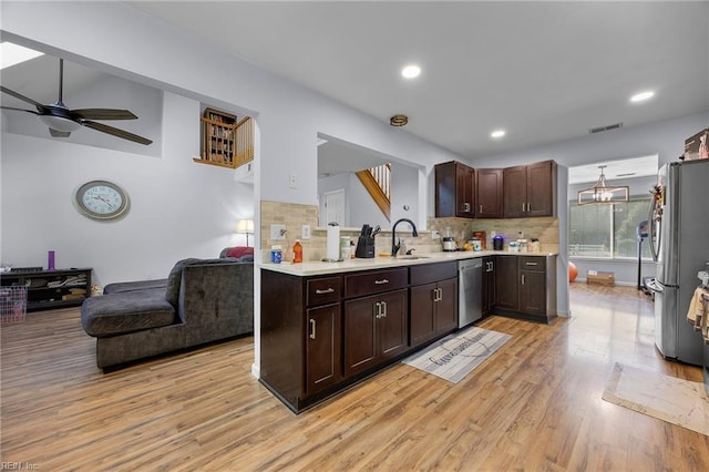4041 Hargrove Lndg, Suffolk, VA 23435 - kitchen with appliances with stainless steel finishes, light wood-style floors, a ceiling fan, dark brown cabinets, and light countertops
