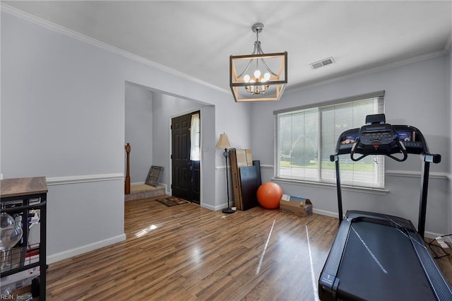 4041 Hargrove Lndg, Suffolk, VA 23435 - workout area featuring wood finished floors, a chandelier, and crown molding