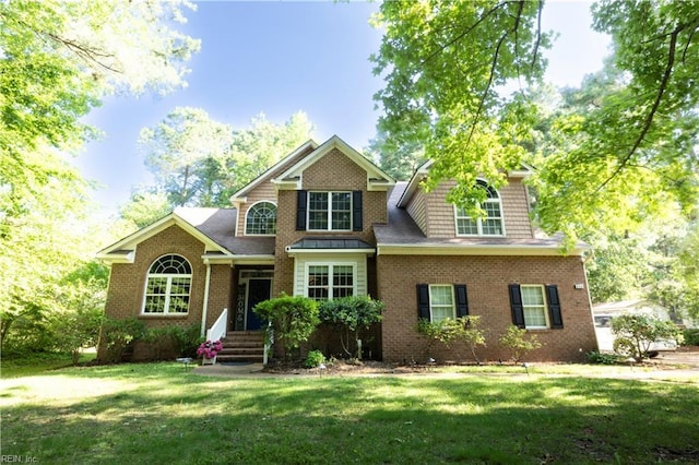 412 Yorkville Rd, Yorktown, VA 23692 - traditional home with a front yard and brick siding