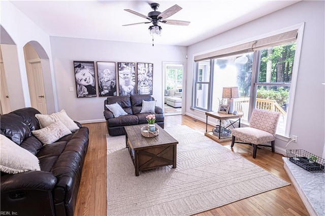412 Yorkville Rd, Yorktown, VA 23692 - living area featuring healthy amount of natural light, arched walkways, ceiling fan, and wood finished floors