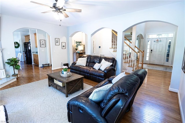 412 Yorkville Rd, Yorktown, VA 23692 - living area featuring ceiling fan, hardwood / wood-style floors, arched walkways, and stairway
