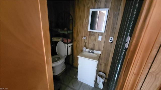 2209 Saint Denis Ave, Norfolk, VA 23509 - bathroom with vanity and wood walls