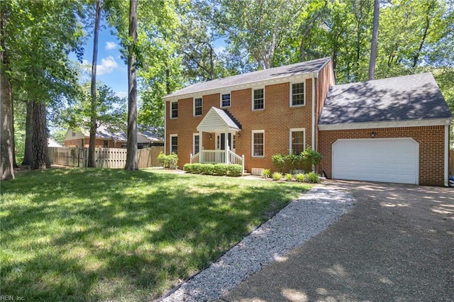 605 Hollygate Ln, Chesapeake, VA 23322 - colonial home with an attached garage, brick siding, driveway, and a shingled roof