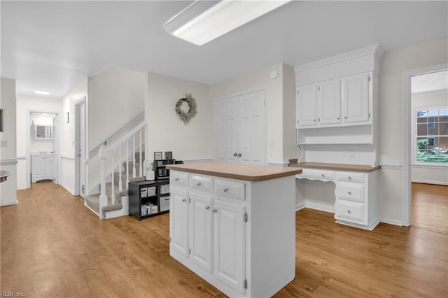 605 Hollygate Ln, Chesapeake, VA 23322 - kitchen featuring white cabinets, light wood-style floors, and a kitchen island
