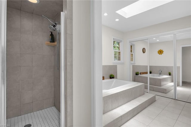 605 Hollygate Ln, Chesapeake, VA 23322 - bathroom with a skylight, a bath, tile patterned floors, a stall shower, and recessed lighting