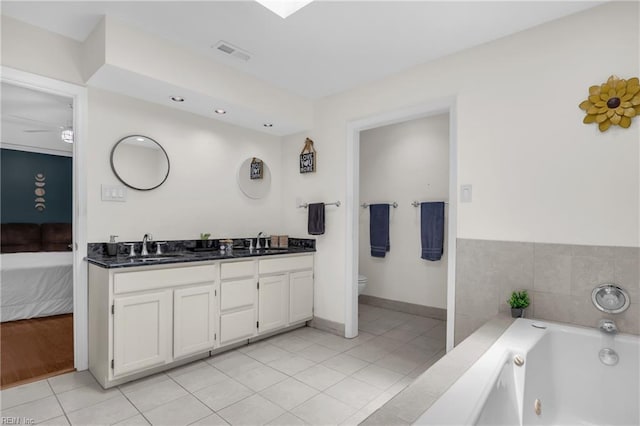 605 Hollygate Ln, Chesapeake, VA 23322 - full bathroom featuring double vanity, a whirlpool tub, tile patterned flooring, and ensuite bath
