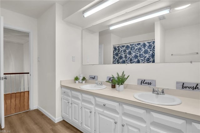 605 Hollygate Ln, Chesapeake, VA 23322 - full bath featuring double vanity and wood finished floors