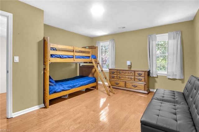 605 Hollygate Ln, Chesapeake, VA 23322 - bedroom with wood finished floors and multiple windows