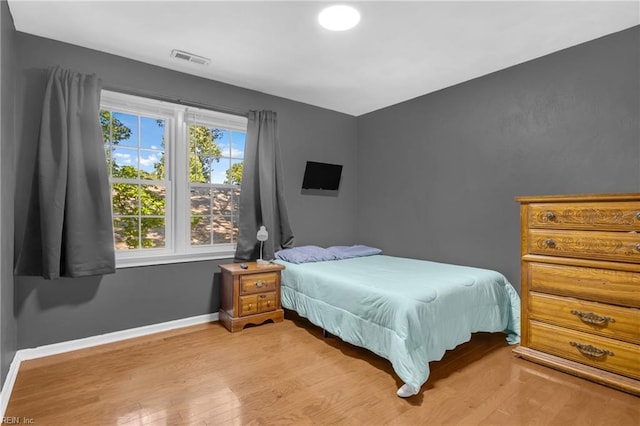 605 Hollygate Ln, Chesapeake, VA 23322 - bedroom with light wood-type flooring and baseboards