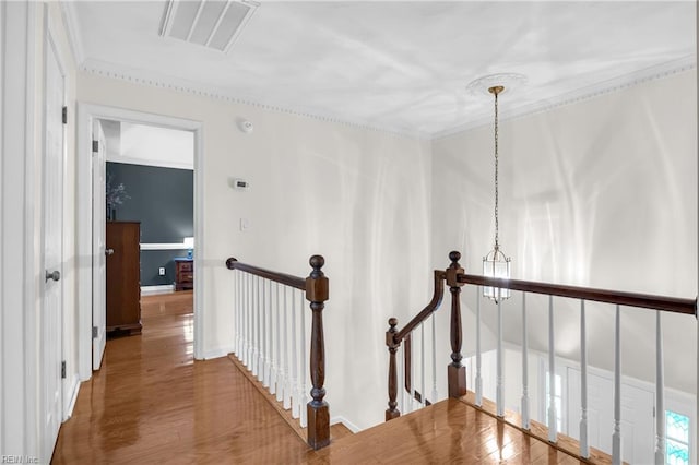 605 Hollygate Ln, Chesapeake, VA 23322 - hallway with an upstairs landing, wood finished floors, and ornamental molding