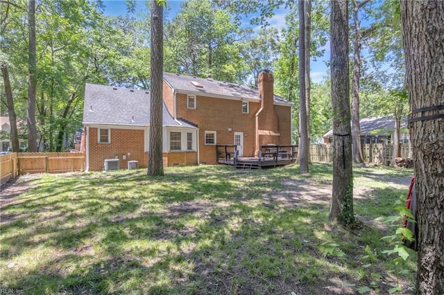 605 Hollygate Ln, Chesapeake, VA 23322 - back of house with a deck, a chimney, a fenced backyard, and brick siding