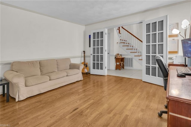 605 Hollygate Ln, Chesapeake, VA 23322 - living area with french doors, stairway, ornamental molding, and wood finished floors