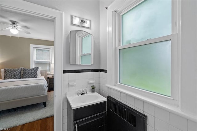 440 Maryland Ave, Norfolk, VA 23508 - ensuite bathroom featuring radiator, vanity, a ceiling fan, and wood finished floors