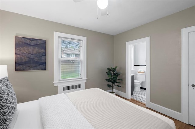 440 Maryland Ave, Norfolk, VA 23508 - bedroom with radiator, wood finished floors, ensuite bathroom, and ceiling fan