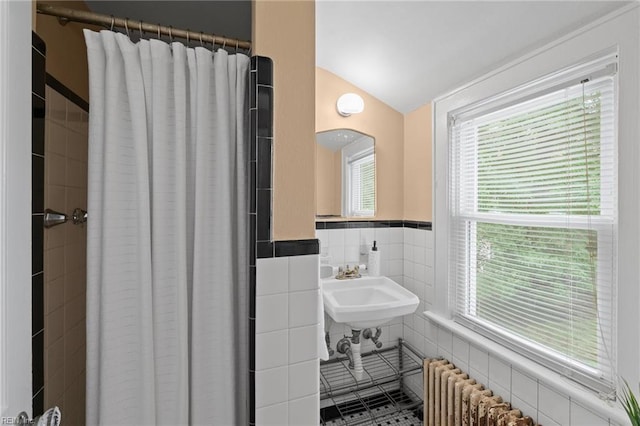 440 Maryland Ave, Norfolk, VA 23508 - bathroom featuring lofted ceiling, tile walls, radiator heating unit, a shower with curtain, and plenty of natural light