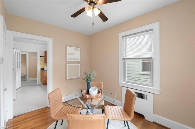 440 Maryland Ave, Norfolk, VA 23508 - dining area featuring radiator heating unit, light wood-style floors, and a ceiling fan