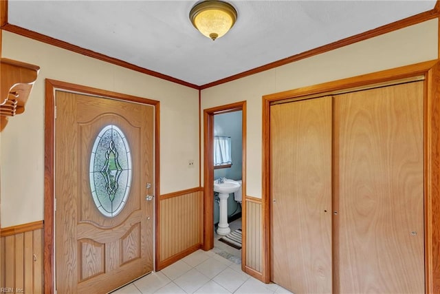4861 Honeygrove Rd, Virginia Beach, VA 23455 - foyer entrance featuring wainscoting, ornamental molding, and light tile patterned floors