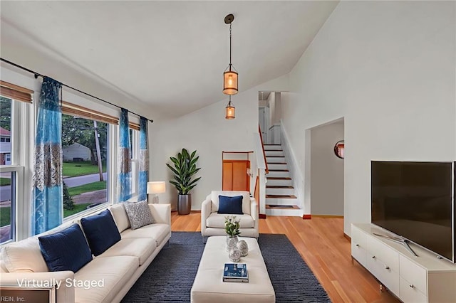 4861 Honeygrove Rd, Virginia Beach, VA 23455 - living room with vaulted ceiling, stairway, and light wood-style flooring