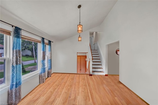 4861 Honeygrove Rd, Virginia Beach, VA 23455 - unfurnished room featuring wood finished floors, lofted ceiling, and stairs