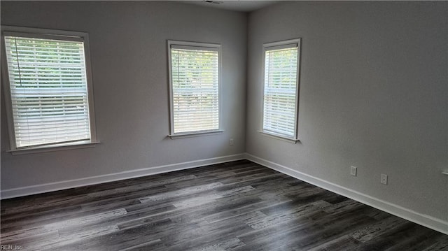 217 Wineberry Way, Yorktown, VA 23692 - empty room with healthy amount of natural light and dark wood-style floors
