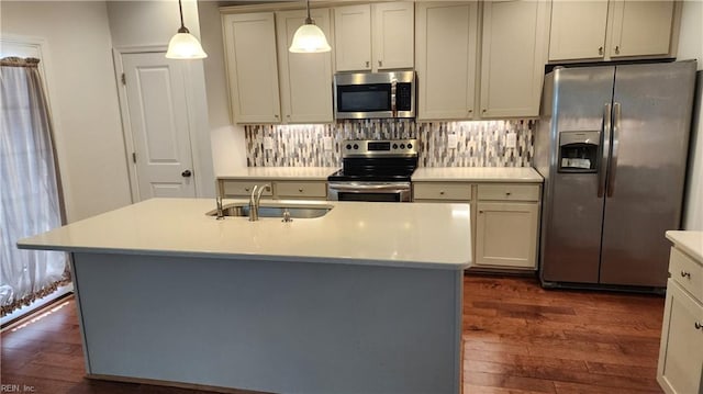 217 Wineberry Way, Yorktown, VA 23692 - kitchen with appliances with stainless steel finishes, dark wood-style flooring, light countertops, and backsplash