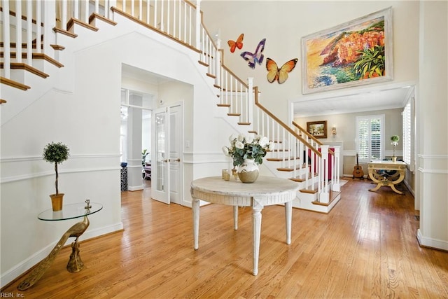 4028 Timber Ridge Dr, Virginia Beach, VA 23455 - entrance foyer featuring stairs, wood finished floors, a towering ceiling, french doors, and ornamental molding