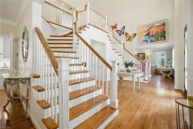 4028 Timber Ridge Dr, Virginia Beach, VA 23455 - stairs featuring wood finished floors, a high ceiling, and crown molding
