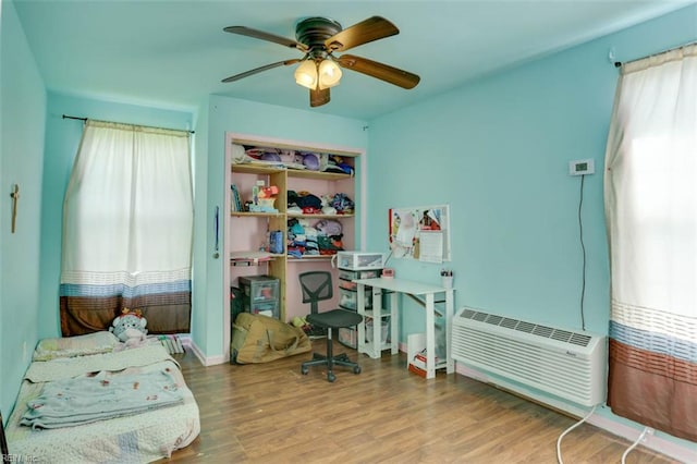 540 Draper Dr, Norfolk, VA 23505 - bedroom with wood finished floors, a wall mounted air conditioner, and ceiling fan