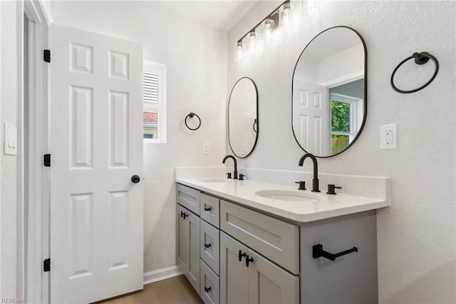 4809 Orchard Ln, Virginia Beach, VA 23464 - bathroom with double vanity, healthy amount of natural light, and a textured wall