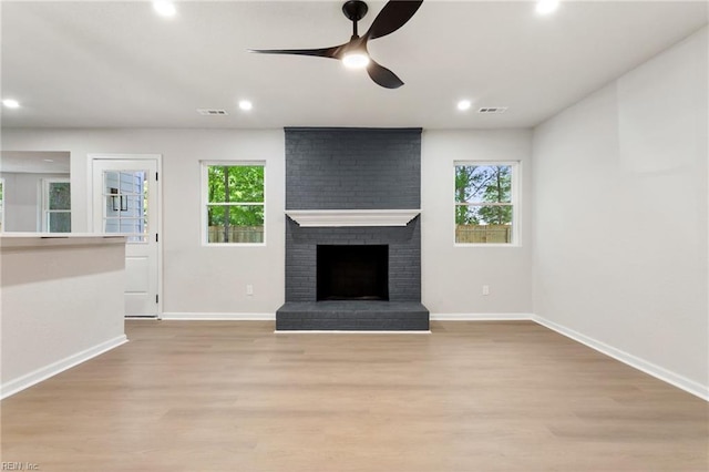 4809 Orchard Ln, Virginia Beach, VA 23464 - unfurnished living room featuring healthy amount of natural light, light wood-style floors, ceiling fan, recessed lighting, and a fireplace