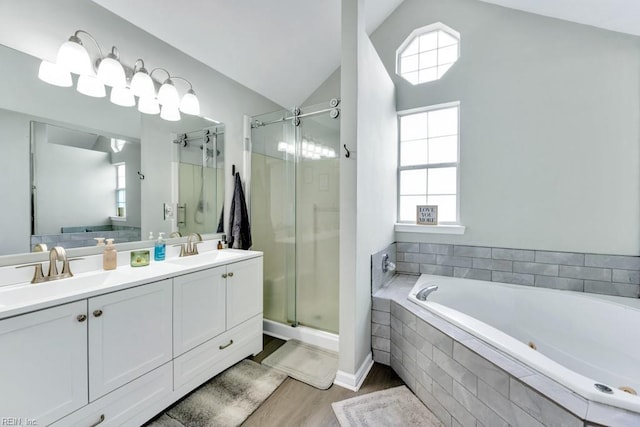 188 Squire Reach Reach, Suffolk, VA 23434 - full bath featuring a garden tub, a stall shower, double vanity, vaulted ceiling, and wood finished floors