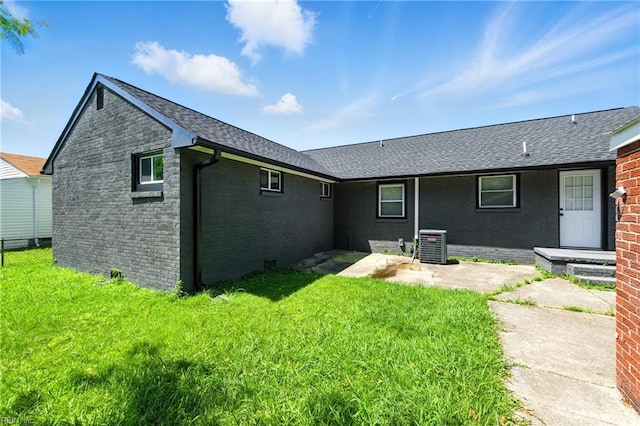 78 Calvary Ter, Hampton, VA 23666 - rear view of house with brick siding, a lawn, and a shingled roof