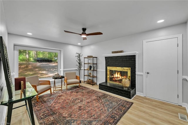 2 Clarendon Ct, Williamsburg, VA 23188 - sitting room with wood finished floors, a fireplace, ceiling fan, and recessed lighting