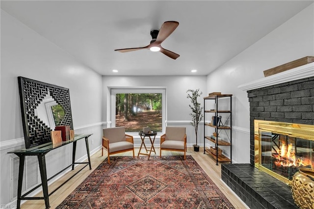 2 Clarendon Ct, Williamsburg, VA 23188 - living area with a brick fireplace, light wood-type flooring, ceiling fan, and recessed lighting