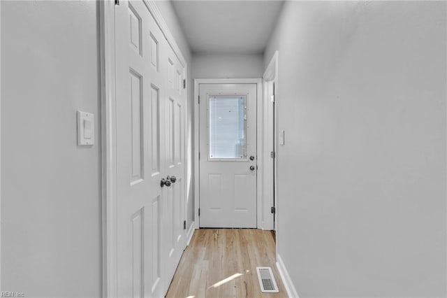 2 Clarendon Ct, Williamsburg, VA 23188 - doorway with light wood-type flooring and baseboards