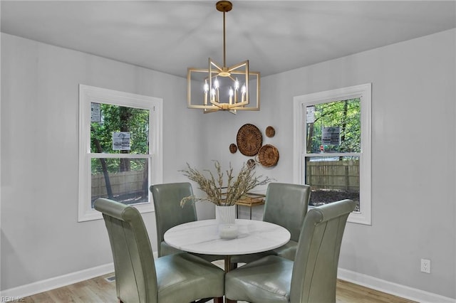 2 Clarendon Ct, Williamsburg, VA 23188 - dining space with a chandelier and light wood finished floors