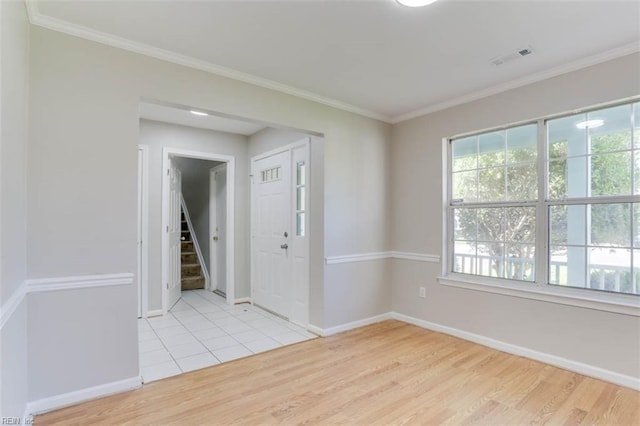 816 Mccrae Dr, Newport News, VA 23608 - empty room featuring light wood finished floors, stairway, and crown molding