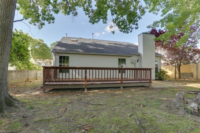 816 Mccrae Dr, Newport News, VA 23608 - back of house featuring a fenced backyard, a deck, a chimney, and roof with shingles