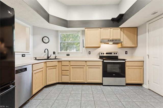100 Peacepipe Pl, Williamsburg, VA 23185 - kitchen featuring appliances with stainless steel finishes, light brown cabinetry, under cabinet range hood, light tile patterned floors, and light countertops