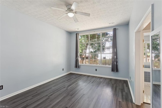 100 Peacepipe Pl, Williamsburg, VA 23185 - unfurnished room featuring dark wood finished floors, a textured ceiling, ceiling fan, and healthy amount of natural light