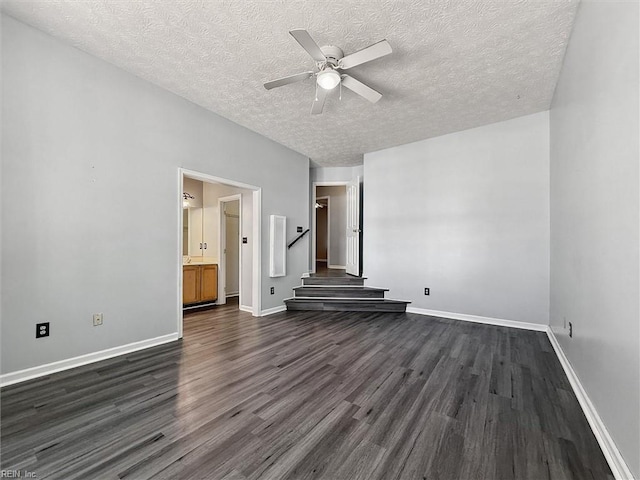 100 Peacepipe Pl, Williamsburg, VA 23185 - unfurnished room featuring dark wood-style floors, ceiling fan, stairs, and a textured ceiling