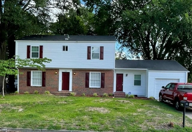 2932 Sunrise Ave, Chesapeake, VA 23324 - colonial-style house with an attached garage, a front yard, brick siding, and entry steps