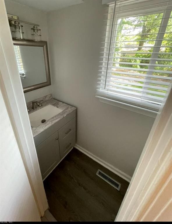 2932 Sunrise Ave, Chesapeake, VA 23324 - bathroom with vanity and wood finished floors