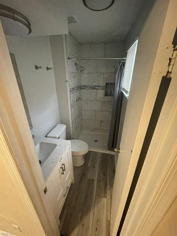 2932 Sunrise Ave, Chesapeake, VA 23324 - full bathroom featuring a shower stall, wood finished floors, and vanity