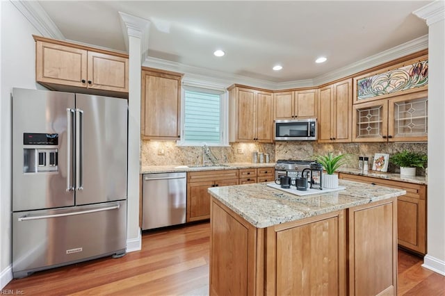 623 London St, Portsmouth, VA 23704 - kitchen with stainless steel appliances, light wood finished floors, tasteful backsplash, light stone counters, and crown molding